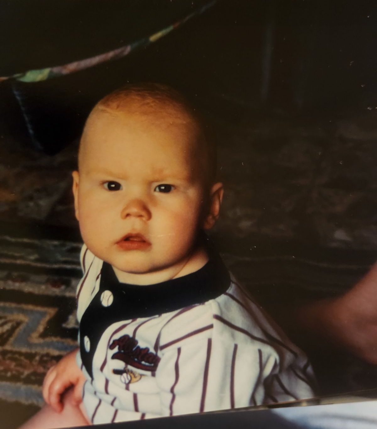 Baby me in a baseball jersey